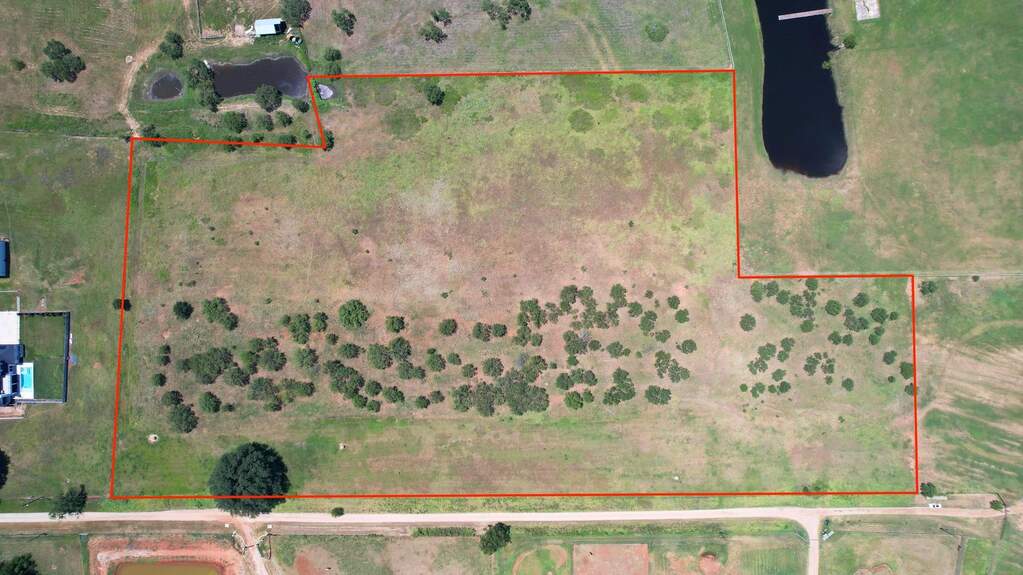 Aerial overview of property's location featuring property boundaries highlighted