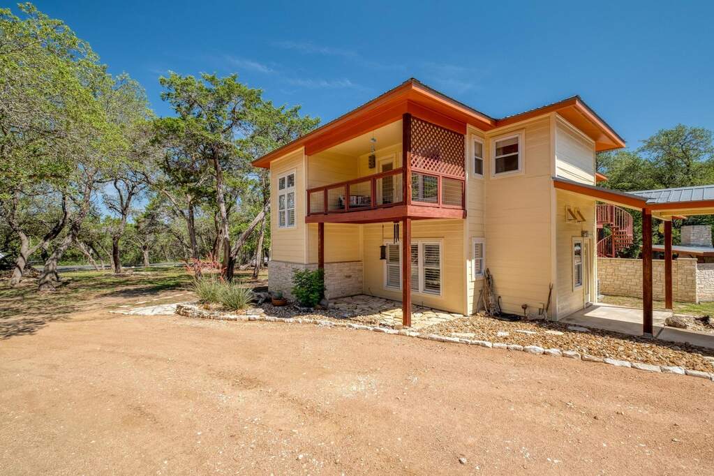 Back of property featuring a balcony