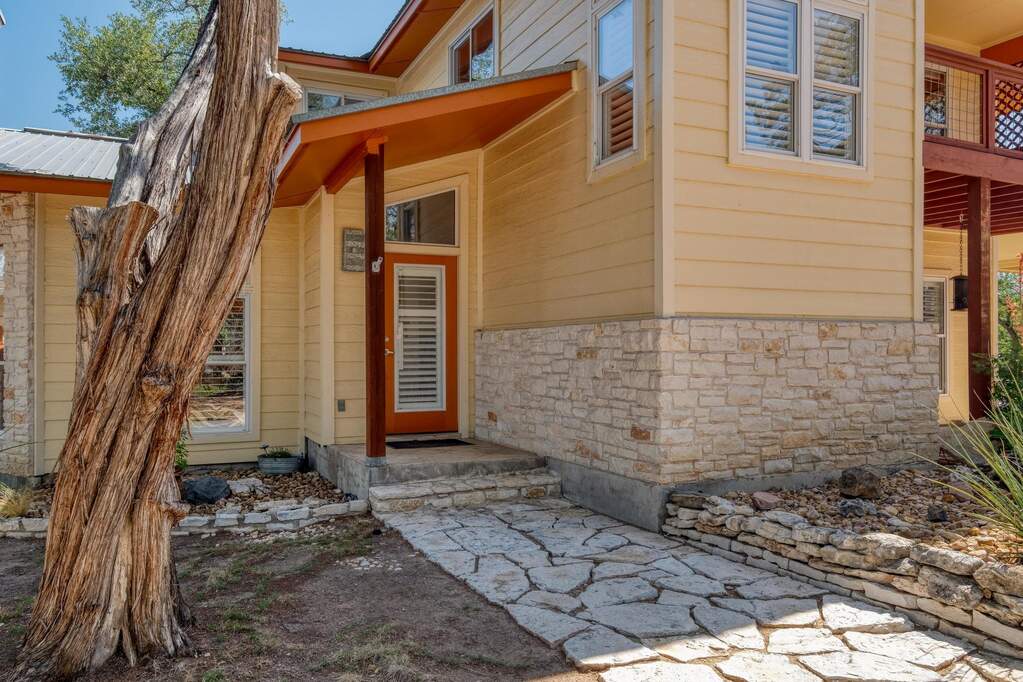Entrance to property with stone siding