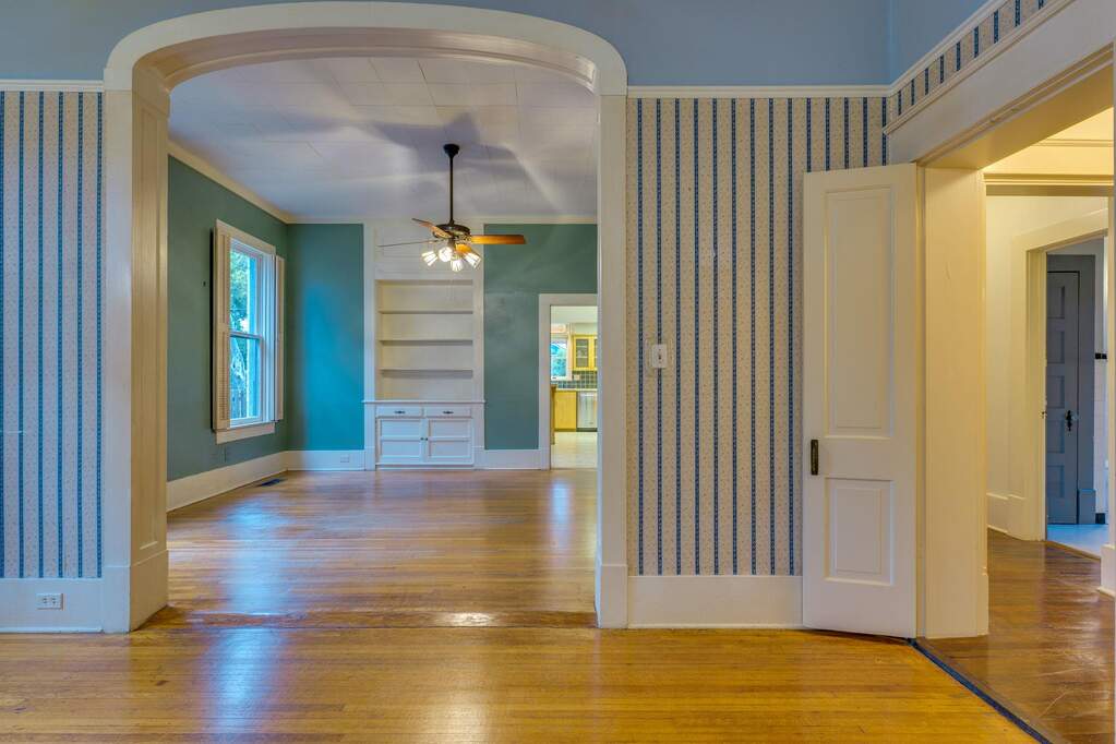 Enter through the parlor to hardwood flooring that extends throughout this versatile space.