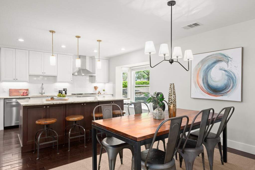 The dining area sits adjacent to the kitchen, making it a natural spot for morning coffee or evening meals