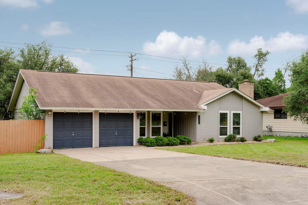 Beautifully home positioned on a spacious corner lot,  updated finishes, and excellent curb appeal in the heart of South Austin