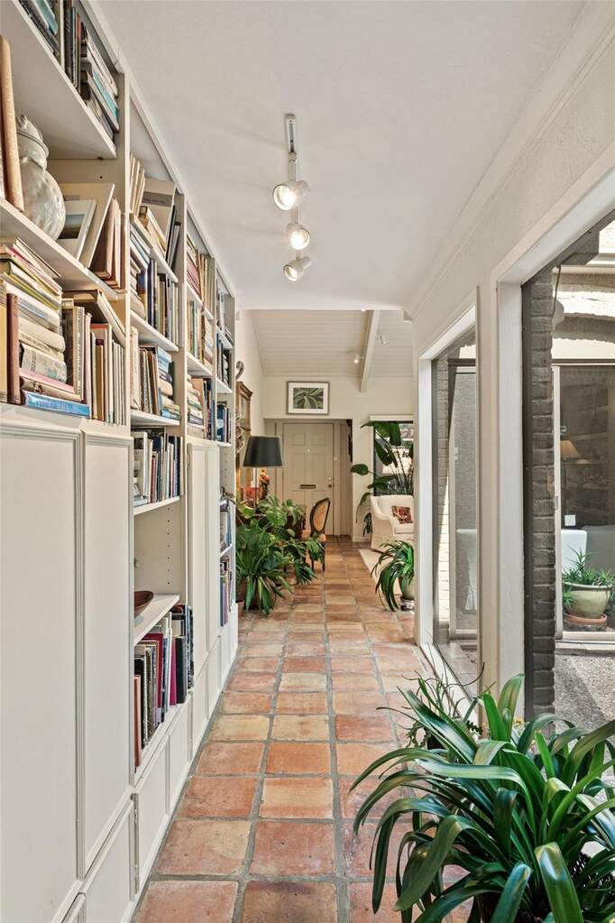 The built-in bookshelves are such a great spot to show off your favorite books, records, or art pieces the second people walk in