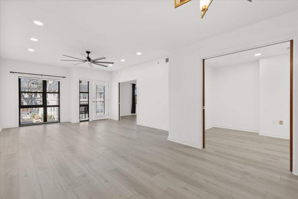 Unfurnished living room with ceiling fan, recessed lighting, and light wood-type flooring