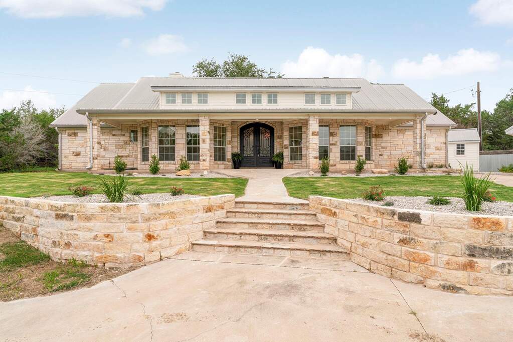 Notice the clerestory windows above the porch—they flood the interior with natural light.