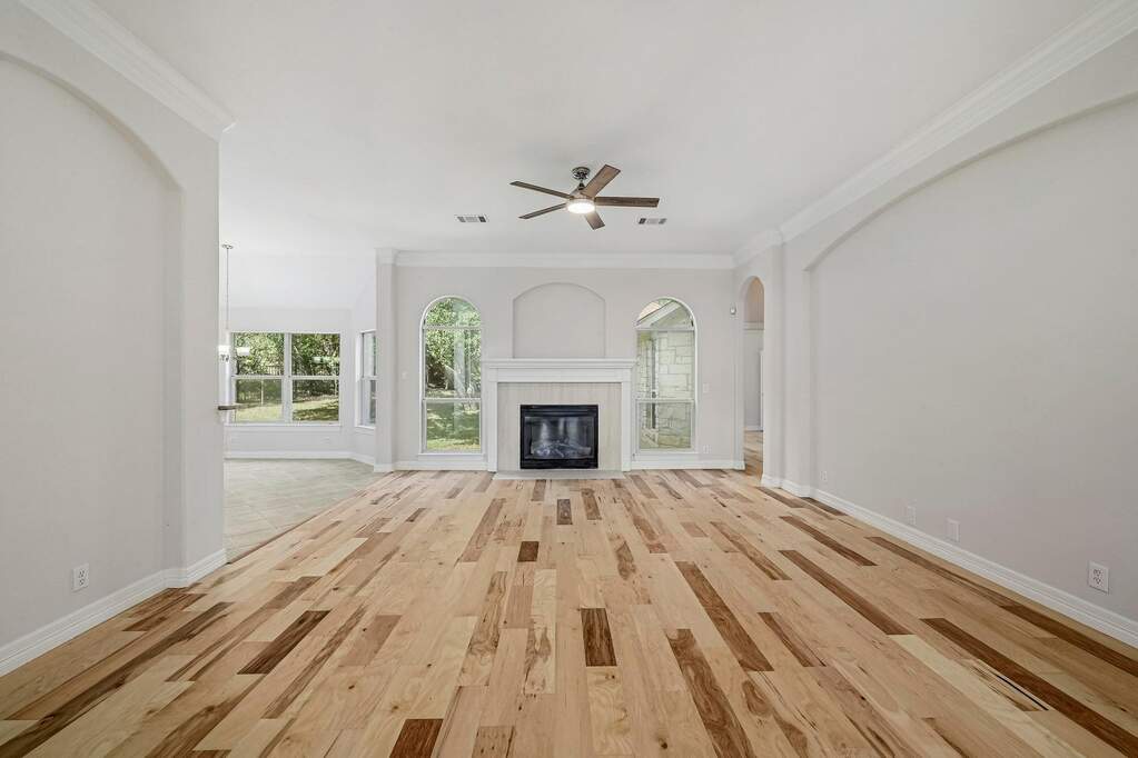 Large main living area focuses on fireplace.