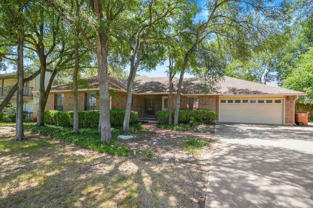 Welcome home to 2116 Wychwood Dr, set beneath a canopy of mature trees in the heart of Westlake Hills