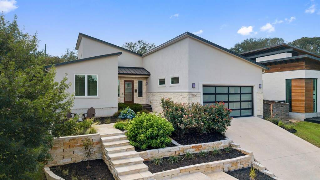 Welcome to this single-story Barton Hills residence, where a beautiful stone and full stucco exterior is framed by an extensive, fully irrigated custom landscaping package to create a truly w