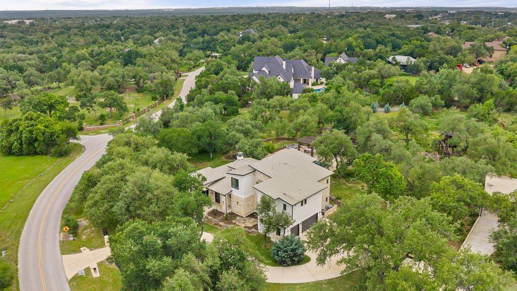 Nearly 3 acres gives you privacy and seclusion- while still walking distance to shopping.