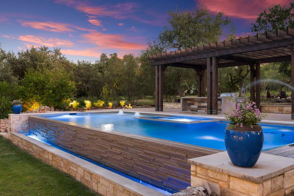 Infinity edge pool with overflow into its own waterfeature.