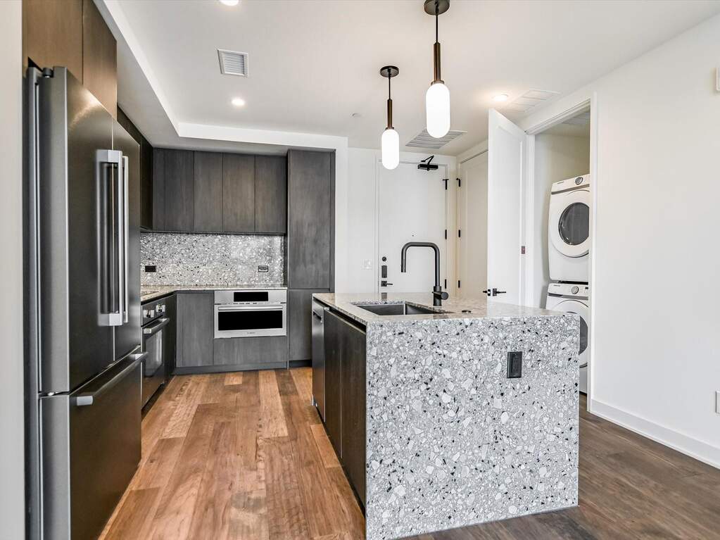 Unit 1503 comes equipped with Bosch stainless steel appliances and Samsung washer and dryer