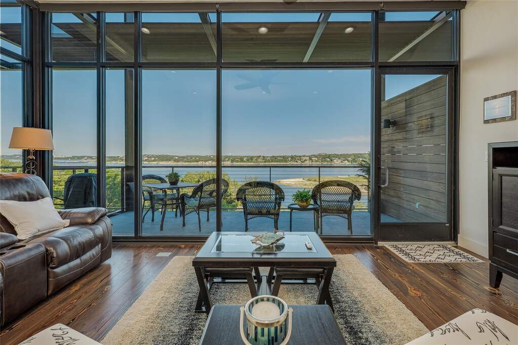 The living area doesn’t just look out at the lake, it almost folds into it.