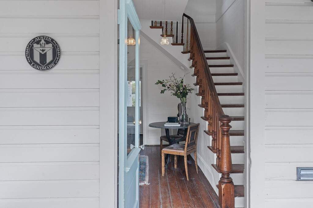 Step into a warm, inviting foyer where gentle light and timeless details welcome you into a space that feels unmistakably like home.