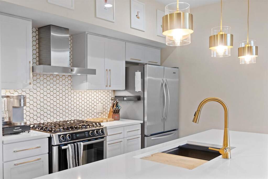 The luxury metallic honeycomb backsplash brings texture and personality, catching light throughout the day