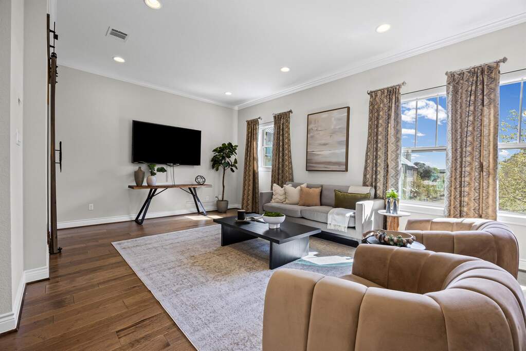 Main living level featuring rich hardwood flooring and open-concept design