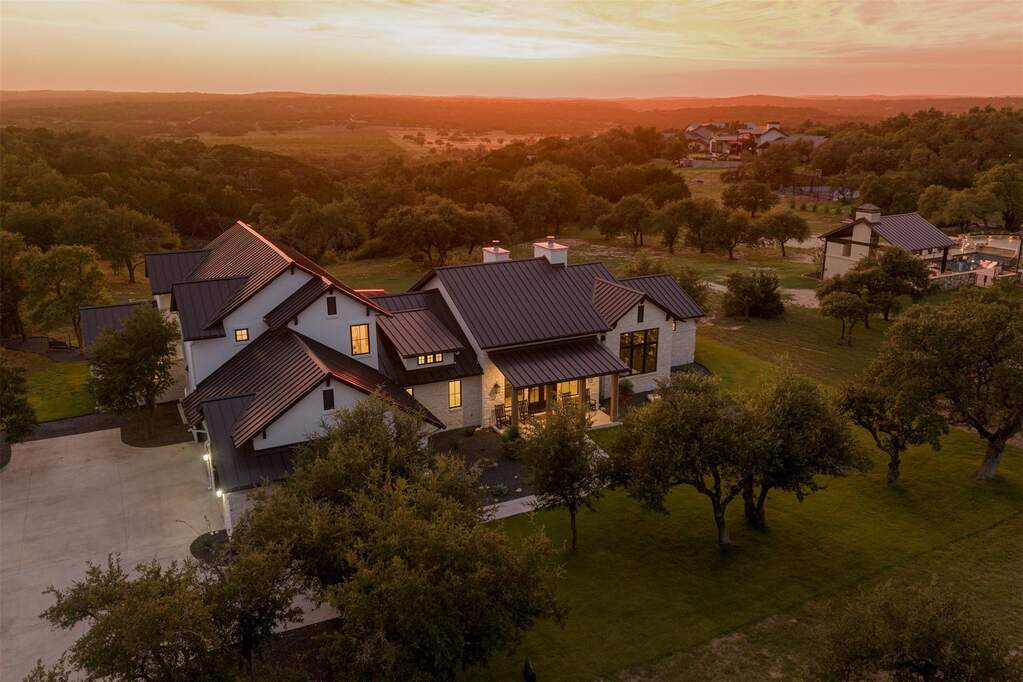 Sprawling across 3.16 acres of pristine Hill Country land, this modern farmhouse estate balances architectural beauty with wide-open space to breathe