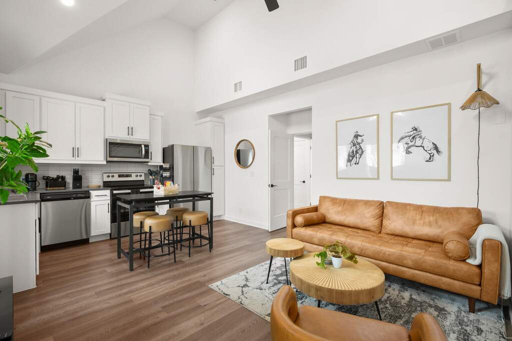 The open concept living area is bright and open, with tall ceilings and plenty of windows to bring the light in