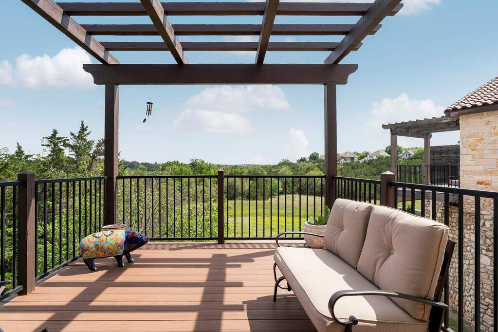 You will enjoy morning coffee over looking the green space and golf course beyond the trees!