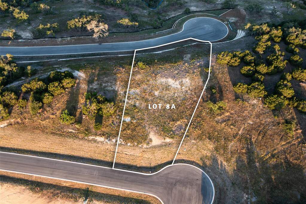 Aerial overview of property's location featuring property parcel outlined